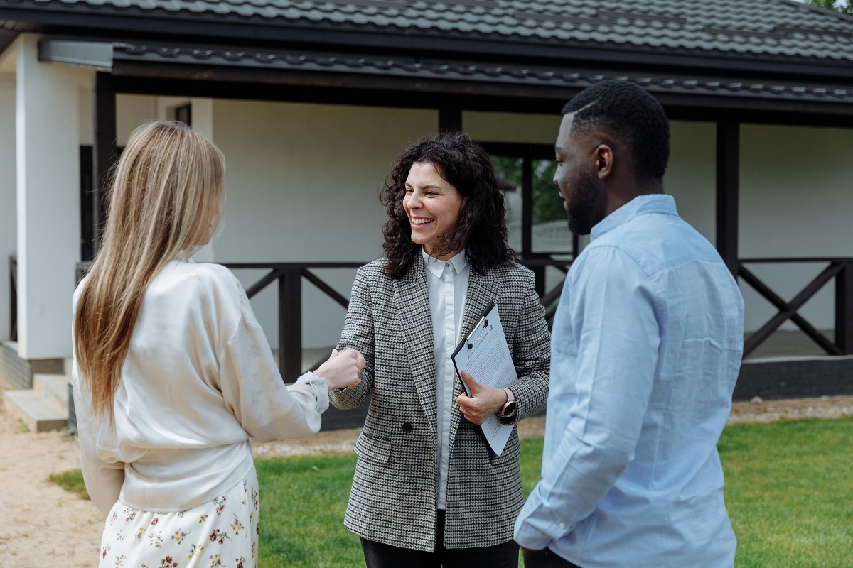potential home buyers shaking hands with the seller
